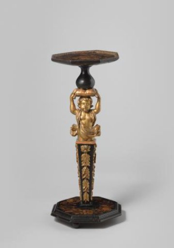 Gueridon decorated with marquetry. Shaft with a putto supporting a cushion held on its head with its hands