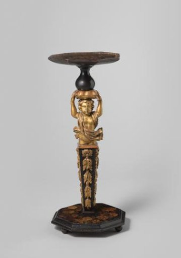 Gueridon decorated with marquetry. Shaft with a putto supporting a cushion held on its head with its hands