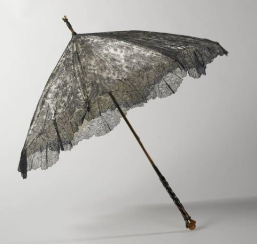 Parasol with a cover of black silk Chantilly lace on a background of white satin, on a bamboo stick with an imitation tortoiseshell knob