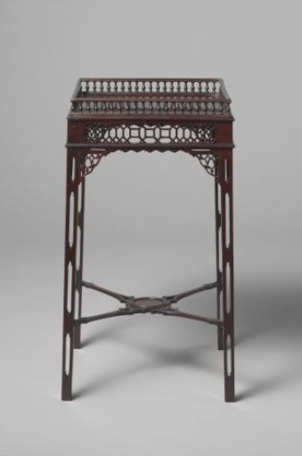 Table, decorated in the Chinese Chippendale style and fitted with a glass top.