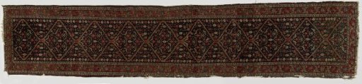 Oriental carpet decorated with lotus flowers, palmettes, rosettes, and birds