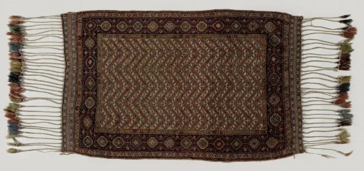 Oriental carpet decorated with floral scrolls