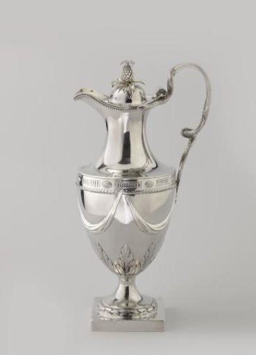 Silver water jug, vase-shaped on a high round foot with a square base. High handle in the form of two intertwined snakes. Vaulted lid with a pineapple finial.