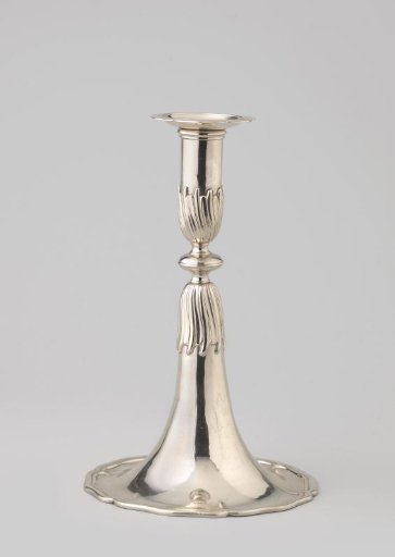 Candelabrum with a round foot divided into six sections that gradually transitions into the stem with a disc-shaped node.