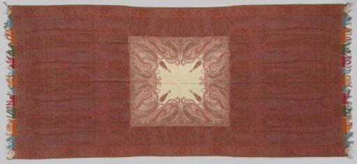 Long shawl with a rectangular field containing a square white medallion with slender palm motifs, the borders consist of S-scrolls with lilies and palmettes