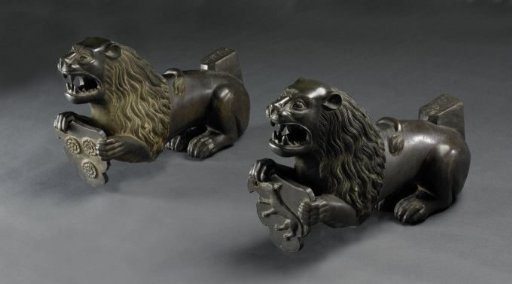 Two lions with a coat of arms