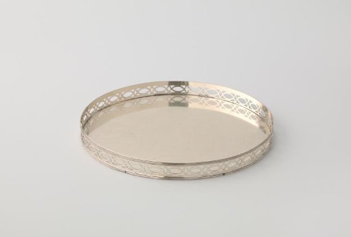 Silver presentation plate, round, with raised rim, pierced with crossed circular segments