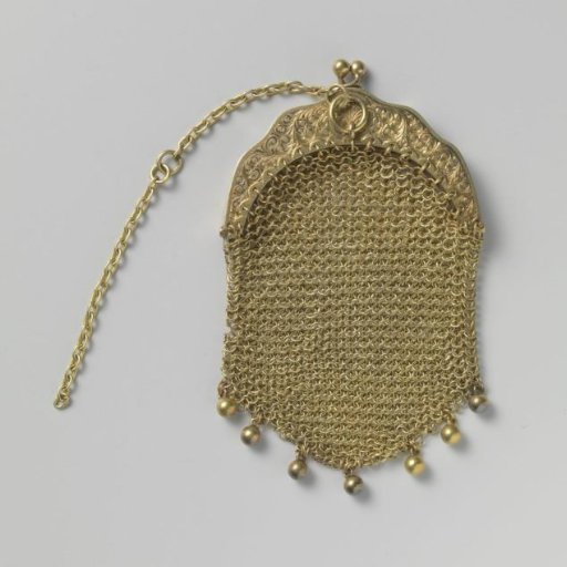 Gold purse of links and a handle with engraving