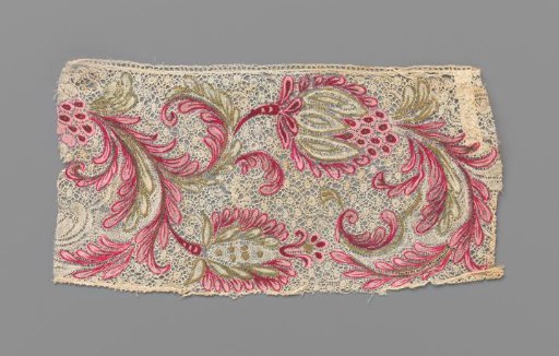 Strip of bobbin lace with pink and gold-painted flowers and leaves