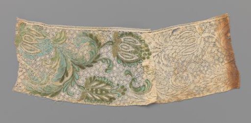 Strip of bobbin lace with light blue and green painted flowers and leaves with some gold accents
