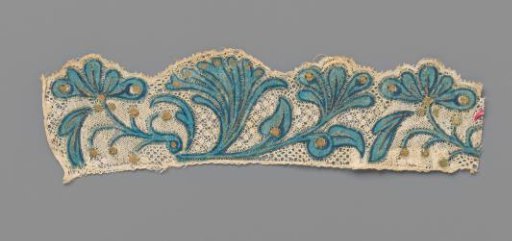 Strip of bobbin lace with pink and gold-painted flowers and leaves