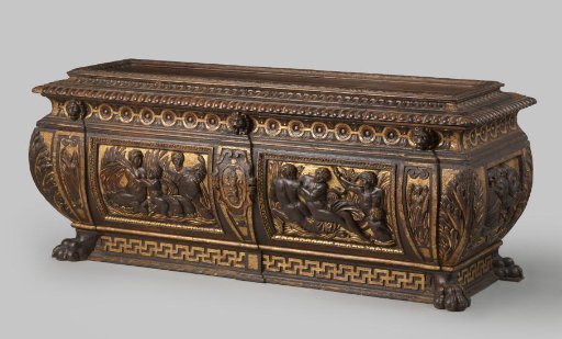 Chest of partially gilded walnut, on claw feet. Front with pilasters, coat of arms and female figures.