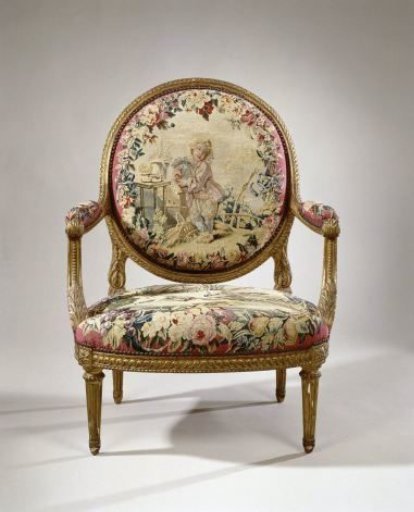 Armchair upholstered with tapestry featuring a boy playing a bagpipe (petit joueur de cornemuse) (back) and a dog hunting ducks (seat)