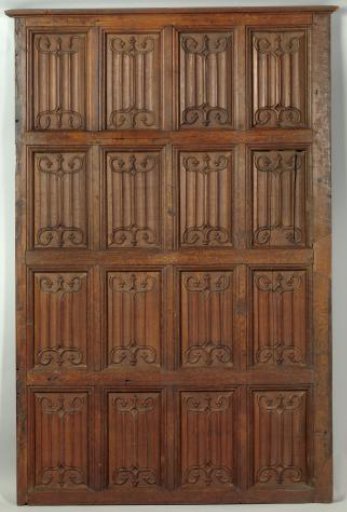 Paneling decorated with panels featuring the "brief" with expanding corner volutes