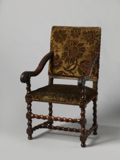 Armchair with splayed legs, upholstered in bronze-colored floral chintz