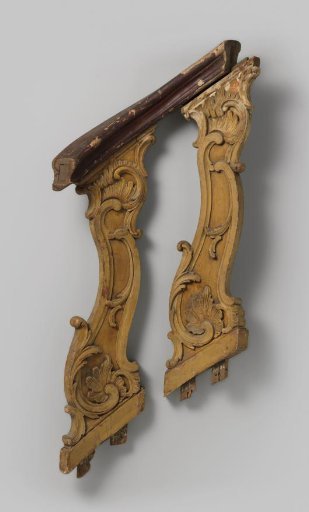 Two balusters with carved C- and S-scrolls