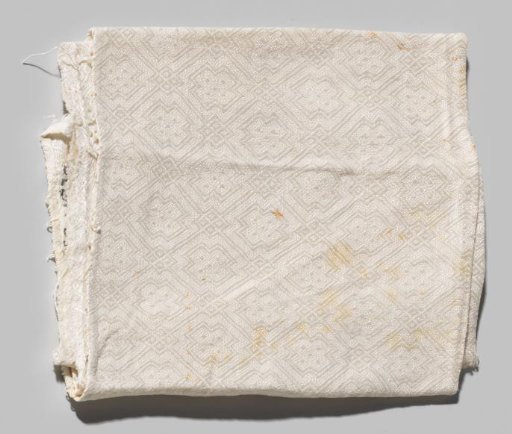 Napkin, fragment, with a pattern of gridwork