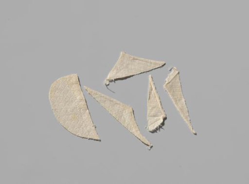 Six fragments of a napkin with cross-stitch pattern