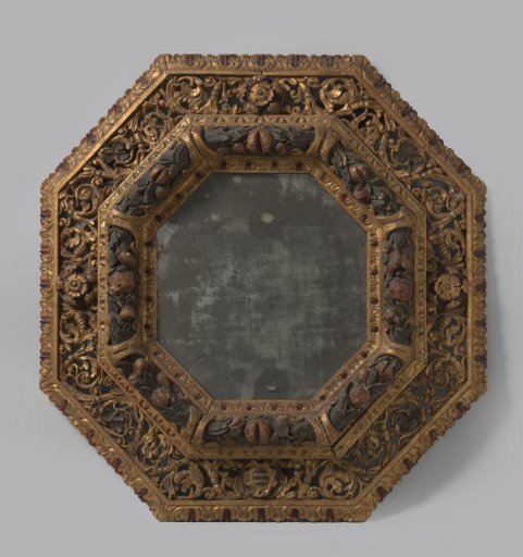 Mirror with an octagonal carved frame of gilded and partially polychromed lime wood