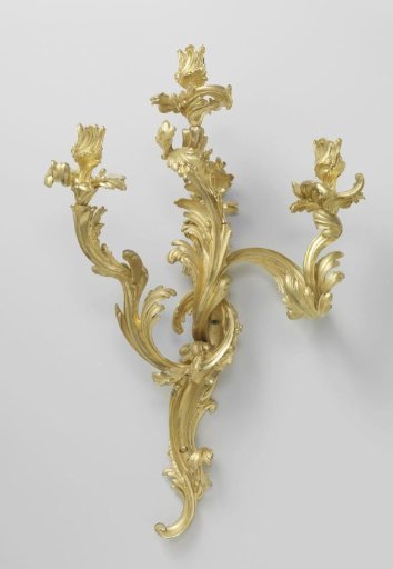 Wall sconce of gilded bronze with three arms built up from asymmetrical C- and S-scrolls