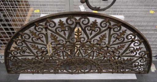 Fanlight, decorated with volute forms and palmettes.
