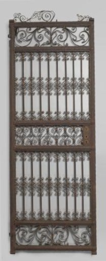 Gate door of wrought iron and gate elements, decorated with heart-shaped composite volutes. Finials in the form of a point with S-volutes. From the Mannheimer collection.