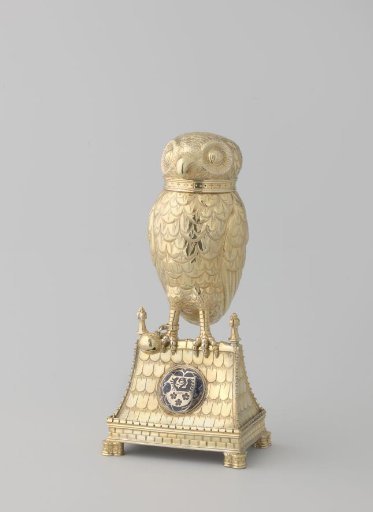 Silver animal figure, depicting an owl on the ridge of a roof. With removable head.