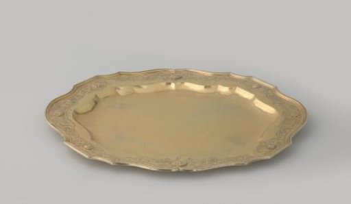 Underplate of gilded silver, oval, decorated with a border of strapwork. With accompanying terrine