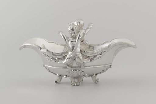 Sauce bowl with figures of children on the short side, their arms forming handles