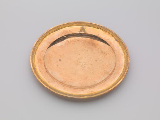 Silver-gilt plate, with palmette border. On the surface the engraved coat of arms of Potemkin.