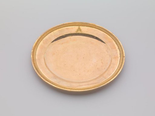 Plate of gilded silver, with palmette border. On the field the engraved coat of arms Potemkin.