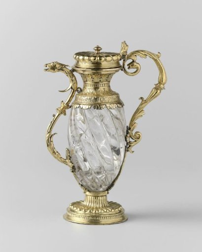 Rock crystal ewer with gilded silver mount after Hans Holbein the Younger. Body elongated and diagonally ribbed, with an S-shaped spout and curved handle, decorated with acanthus leaves ending in a dragon's head