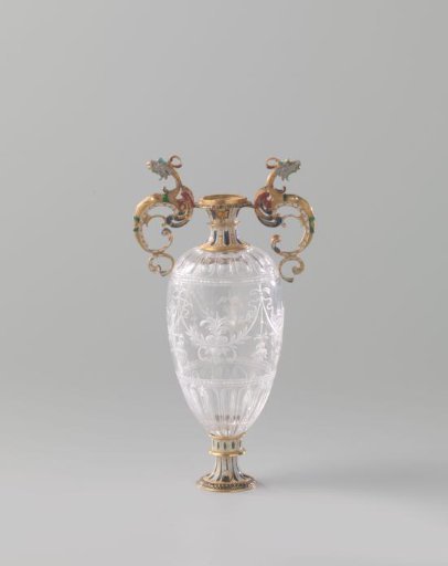 Vase of rock crystal with neck and foot of gold with enamel. The two handles are in the shape of dragons. Decorated with engraving.