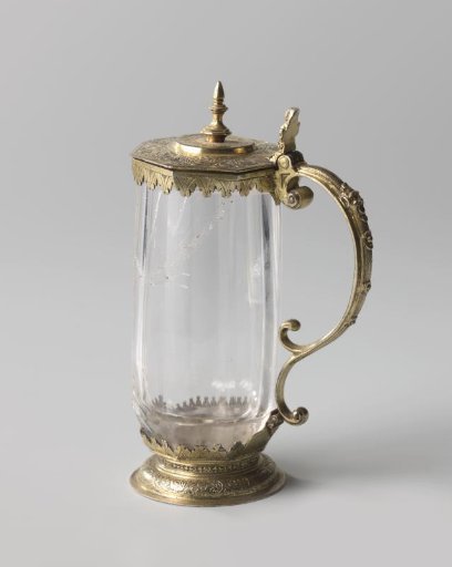 Beer mug with octagonal flat lid, set in a silver mount. Foot rim and lid decorated with etched Moorish ornamentation; cup with vertically cut facets.