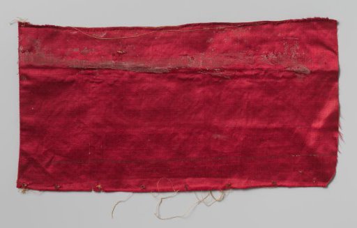 Fragment of wall covering of cerise satin