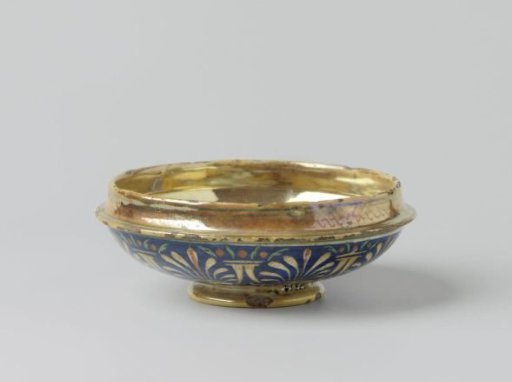 Lid of a lying-in basin, painted in many colors with a putto holding two trumpets