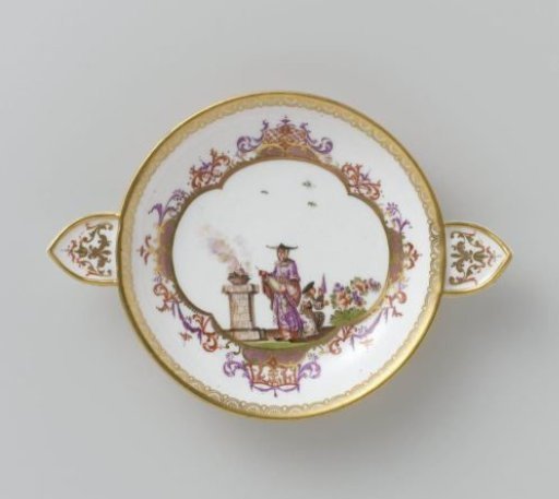 Cup with spout and saucer