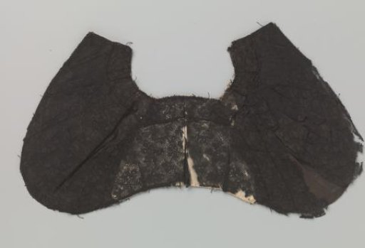 Part of a cap or a collar of black bobbin lace