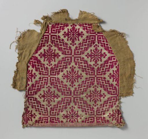 Fragment of chair upholstery in red and white velvet