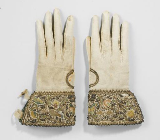 Glove of goatskin with cuffs of cream satin embroidered with multicoloured silk, gilded silver thread, flowers and freshwater pearls, trimmed with gold braid