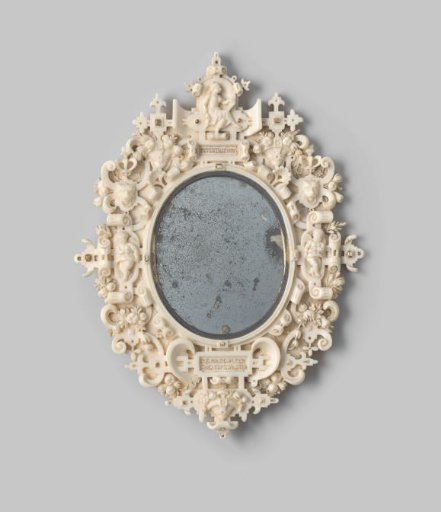 Mirror frame of carved ivory, decorated with scrollwork and fruit