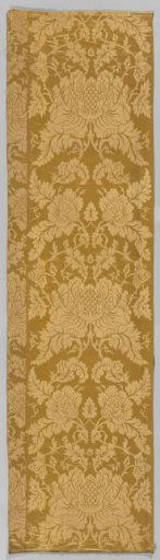 Roll of wall covering of yellow silk damask with a symmetrical pattern of two ascending wavy vines featuring, among other things, peony-shaped flowers