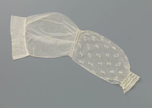 Sleeve of appliqué lace with scattered three-part leaves