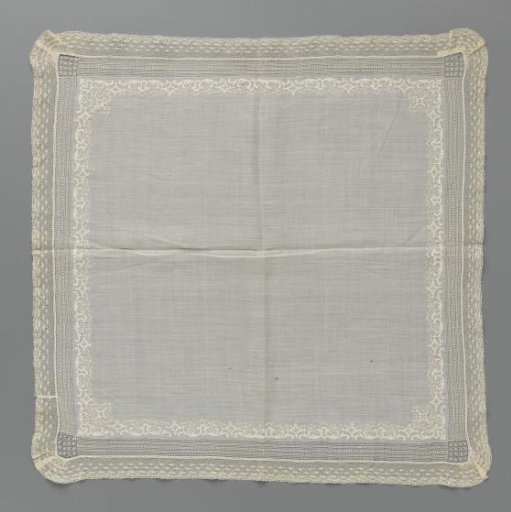 Handkerchief of batiste with a decorative band of embroidery featuring C-scrolls and diamond shapes and a strip of machine lace with snowflakes