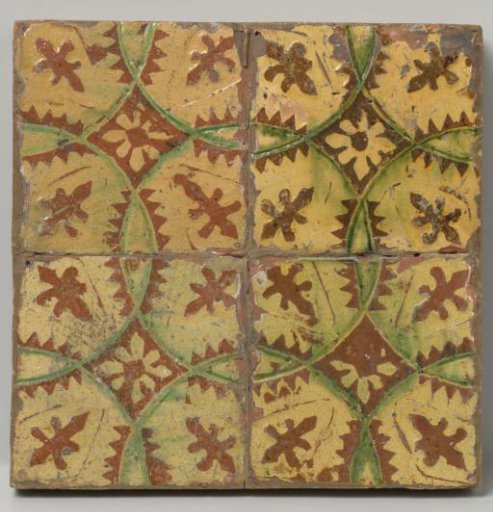Panel of four tiles with circles and rosettes