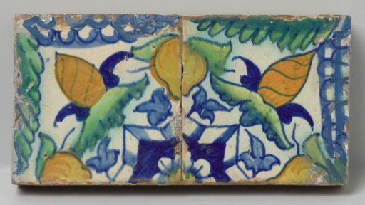 Panel of two tiles with fruits, leaves and grape clusters