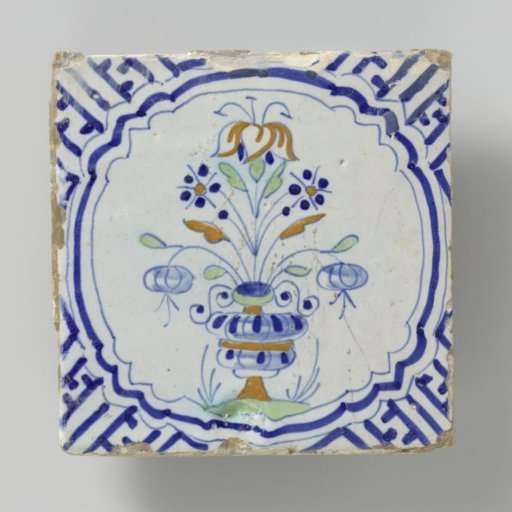 Tile with a multicolored pattern in blue, orange, yellow and green of a flowerpot framed by a bracket with meanders in the corners