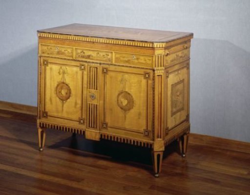 Buffet with a folding top. Marquetry decoration with musical trophies in medallions with ribbons and cords.
