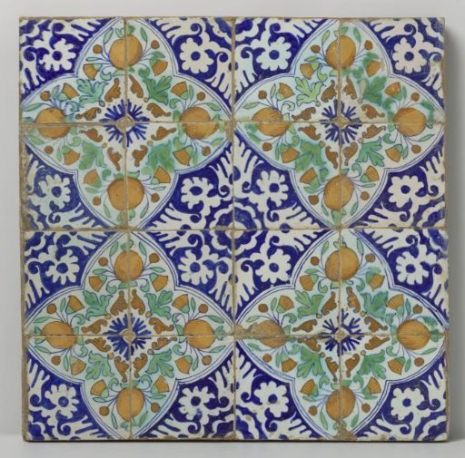 Panel of sixteen tiles with pomegranates and marigolds in a quatrefoil