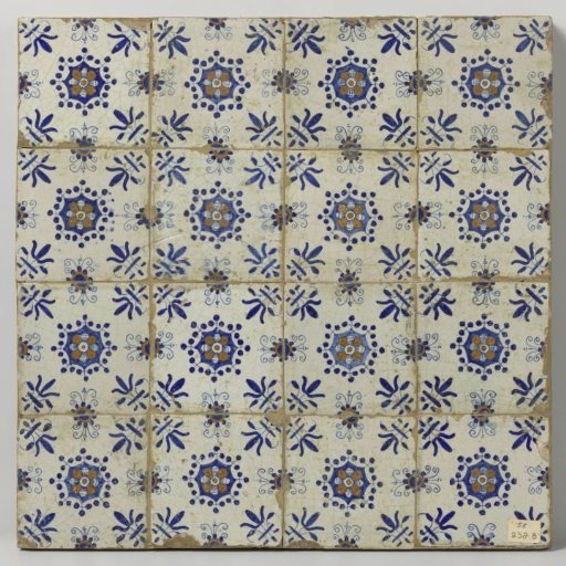 Field of sixteen tiles (4x4), each with a multicolored pattern in blue, yellow and orange of a rosette surrounded by three dots with a lily in the corners